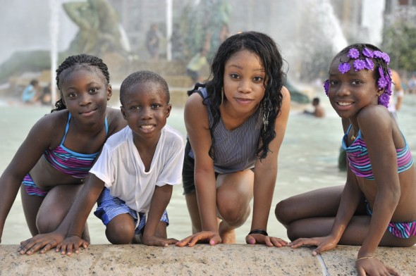 Family members cooling off in the fountain.
